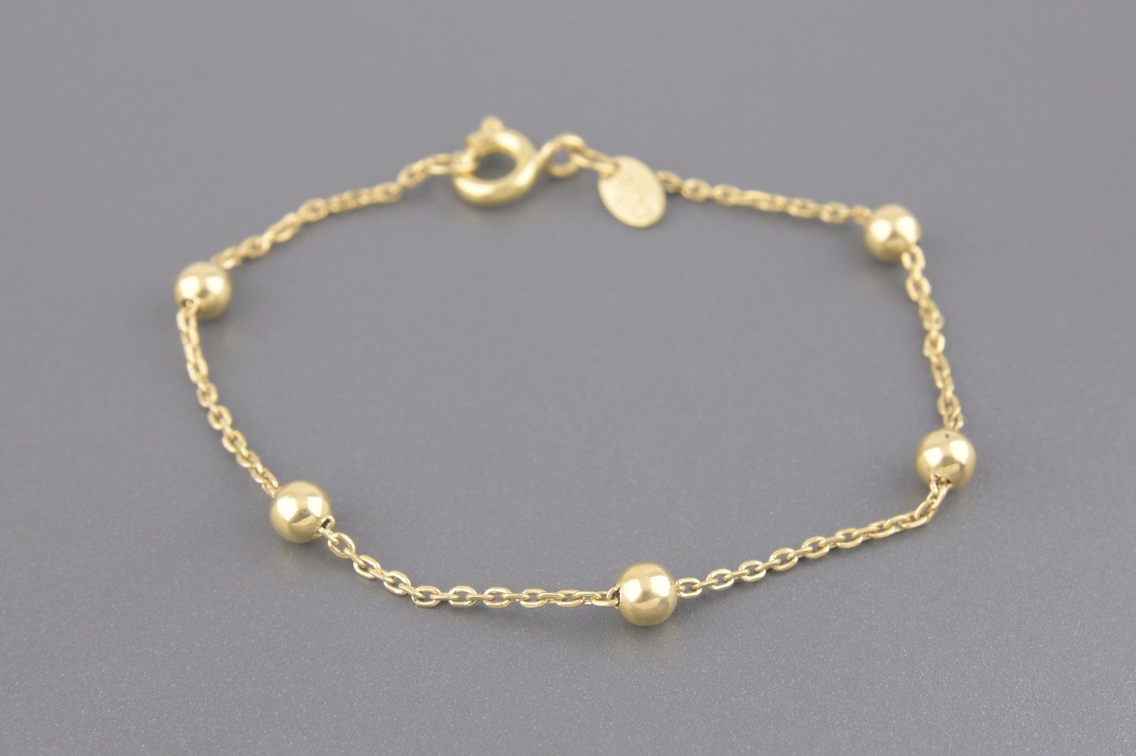 Pulseira Bolinhas Infantil em Ouro Amarelo 18k