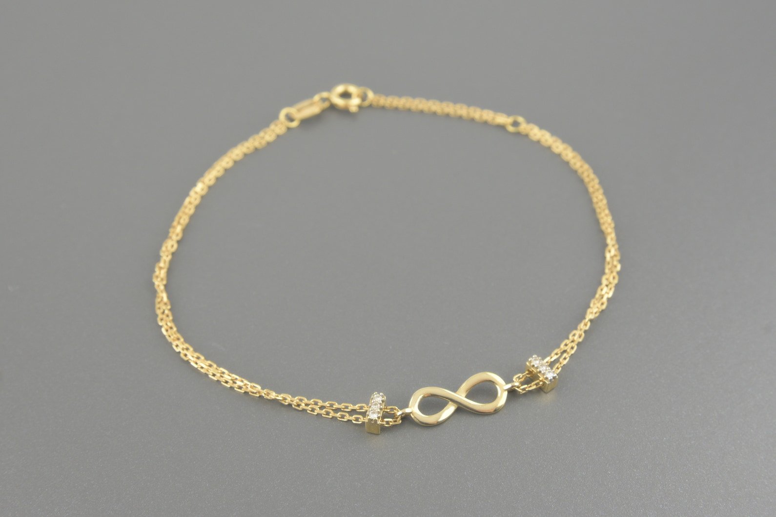Pulseira Infinito em Ouro Amarelo 18k com Aprox. 4.5pts de Brilhantes